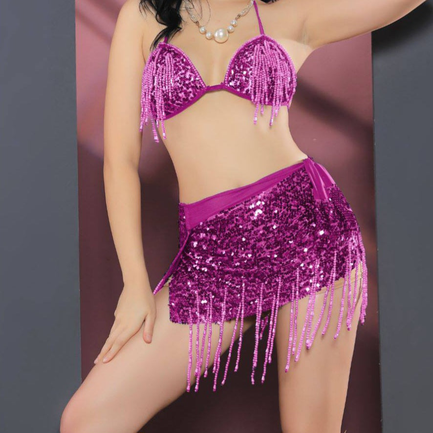 A two-piece belly dance suit made of fish scales with threads of shiny sequins