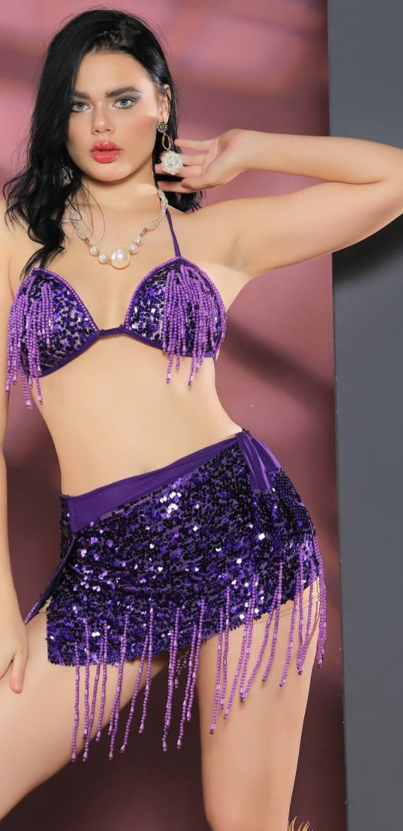 A two-piece belly dance suit made of fish scales with threads of shiny sequins
