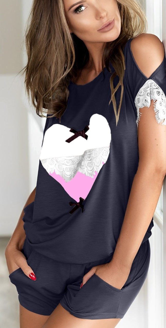 Two-piece cotton pajama with a heart print on the front - with two openings on the sleeves